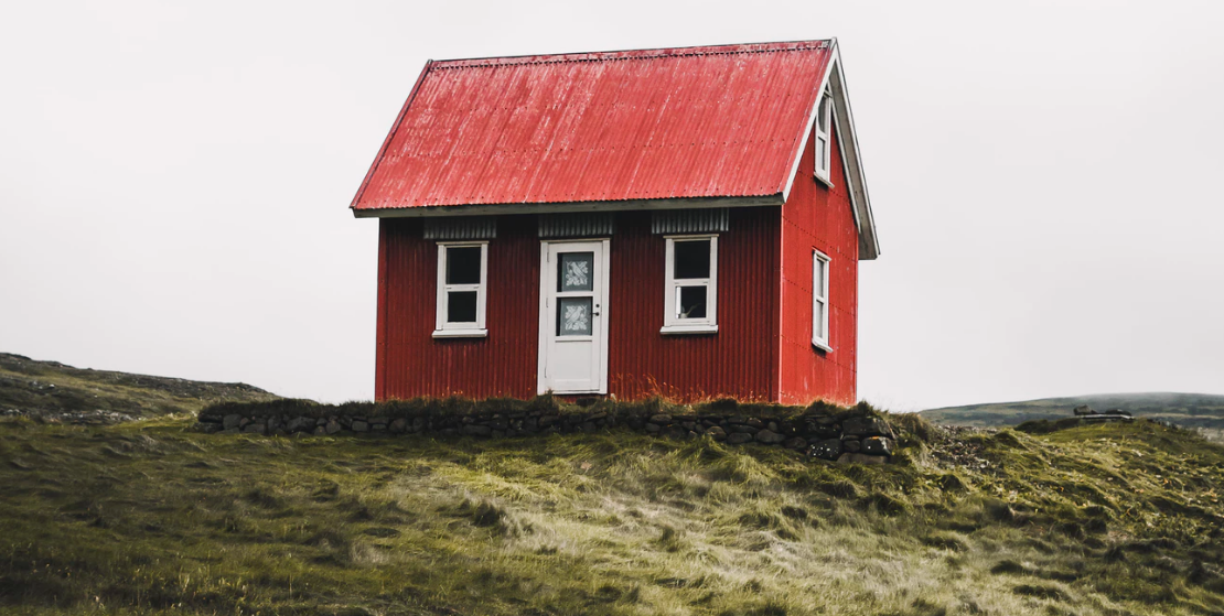 Red house on a plot of land