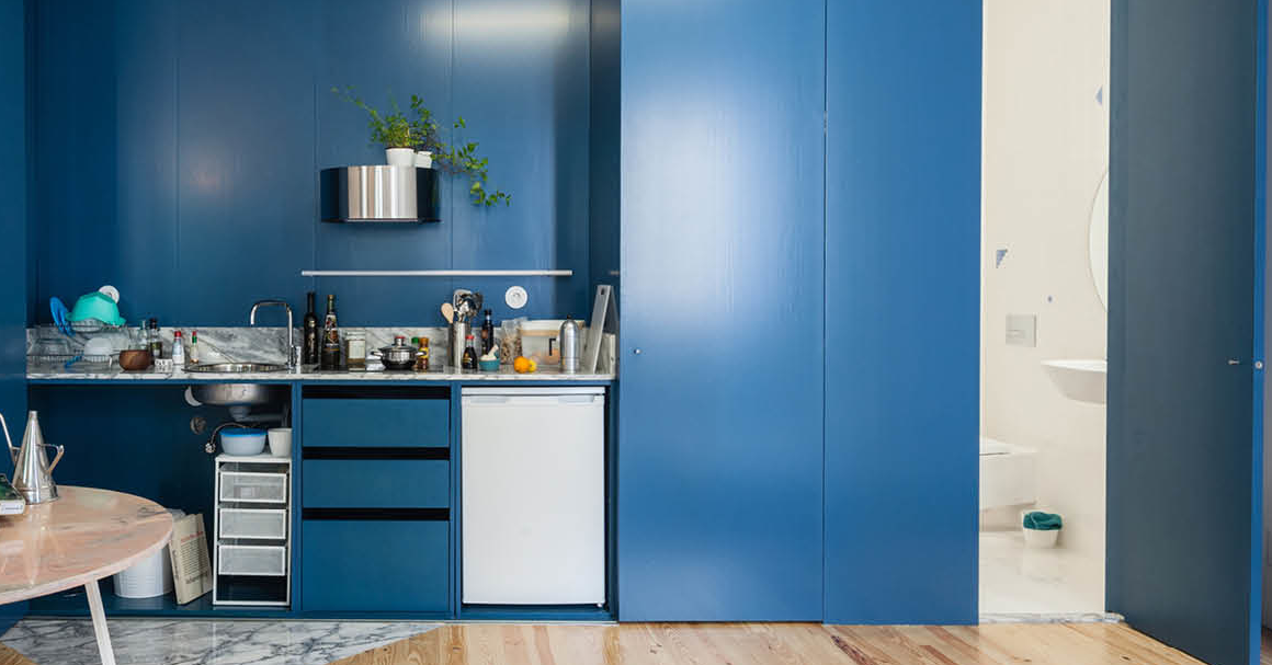 Model of a blue kitchen within a blue closet